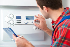 Boiler expert checking new combi boiler 