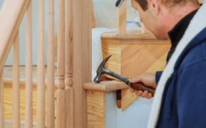Carpenter installing staircase