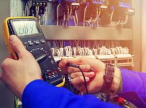 Electrician conducing safety check