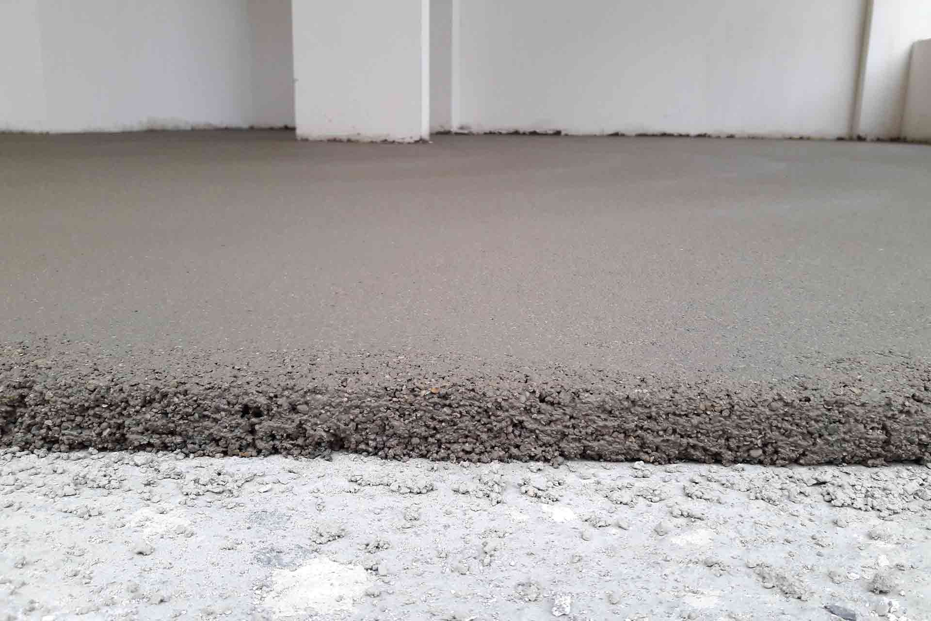 Sanding concrete store floor to level