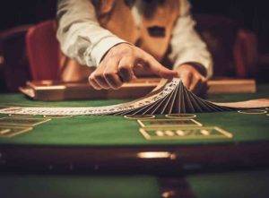 Poker dealer at table