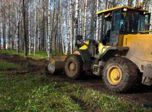 Tractor clearing land