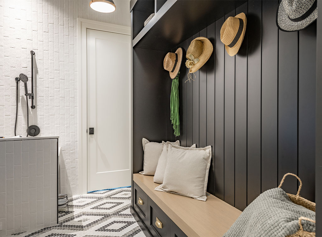 Boot room with charcoal wall panelling