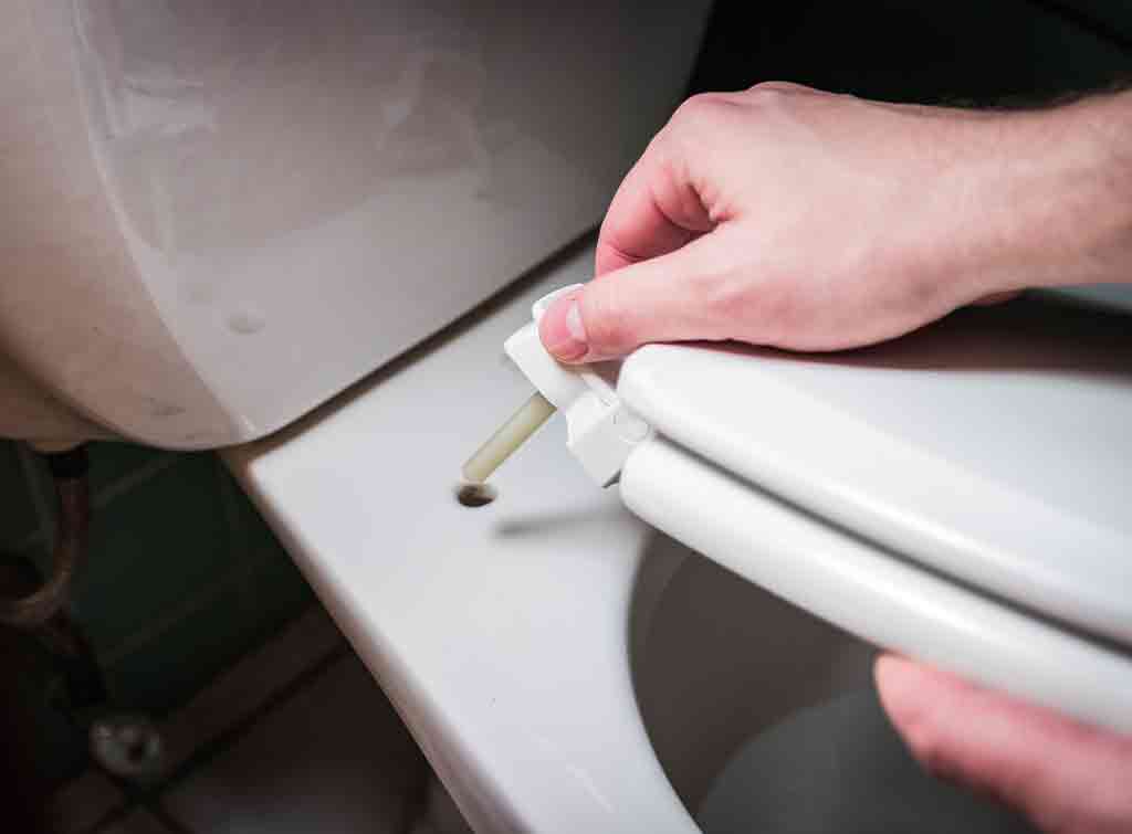 Attaching and tightening a toilet seat
