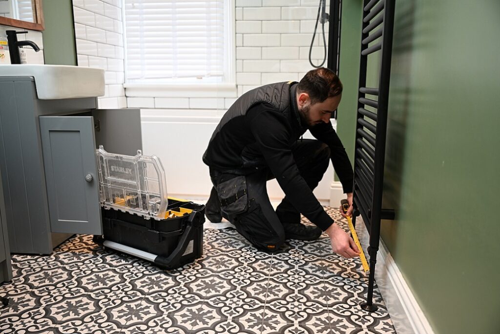 Victorian inspired bathroom. Green walls. Black and white floor tiles