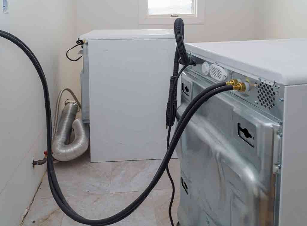 back view of washing machine pipe