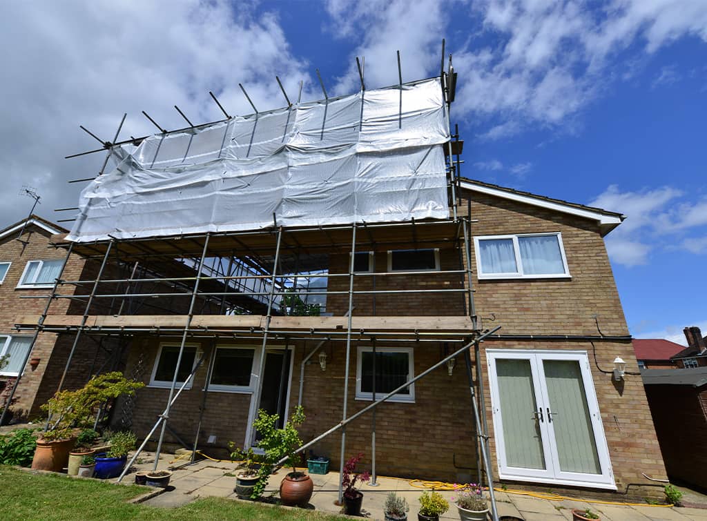 Scaffolding around two storey extension
