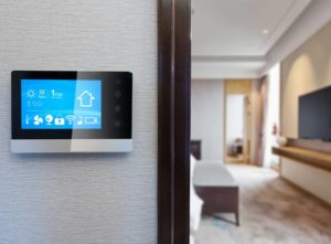A smart thermostat fixed to wall