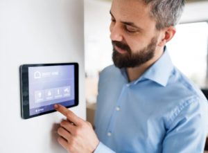 A smart thermostat being operated