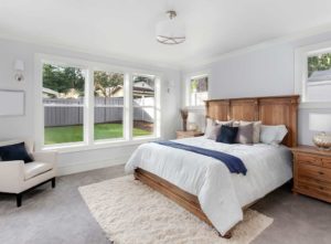 Carpet and rug duo in neutral bedroom