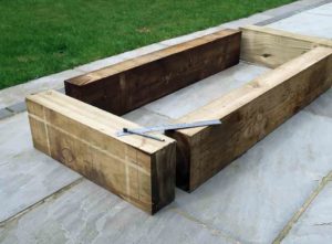 how to build a raised bed with railway sleepers