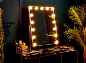 Hollywood style desk mirror with bulbs around the frame
