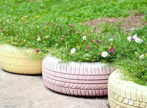 Cheap landscape edging ideas. Wildflowers in tyres.