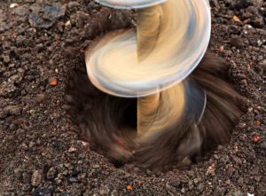 A drilling drilling into the ground - average cost to dig a well