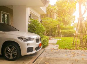 A car parked in a private car park next to the house - cost to build a car park