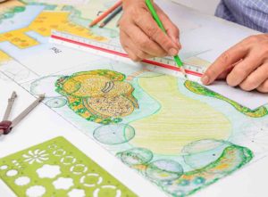 Garden designer planning a garden layout - garden designer cost