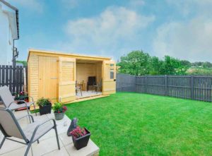 A garden room in a green back garden