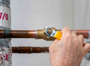 Shutting off a water valve to fix a leaking stopcock