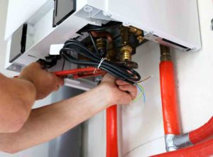 Leaking boiler being fixed