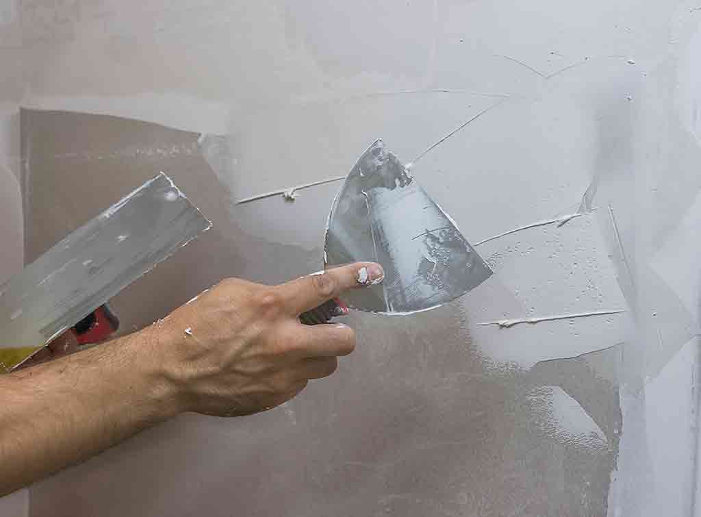 fix cracks in plaster walls