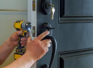 Locksmith changing door lock