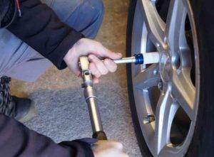 mechanic removing locking wheel nut cost