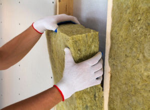 Retrofit insulation being installed