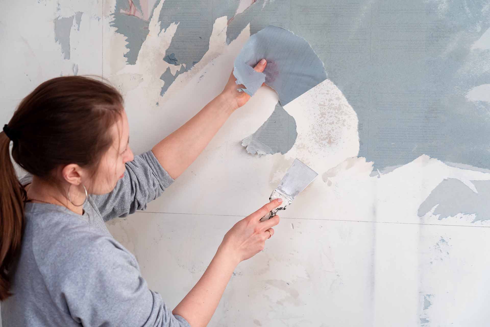 Young Couple Removing Old Wallpaper From Walls Preparing For Flat  Renovation Stock Photo Picture And Royalty Free Image Image 183876940