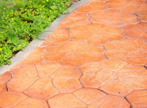 Stamped concrete that looks like terracotta tiles - cheap terracotta outdoor flooring idea