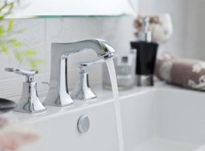 Bathroom tap running in a sink not draining