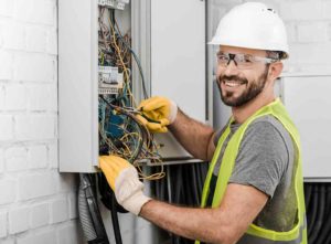 Qualified local electrician checking wiring