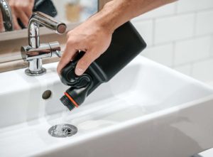 Unblocking product being poured into sink