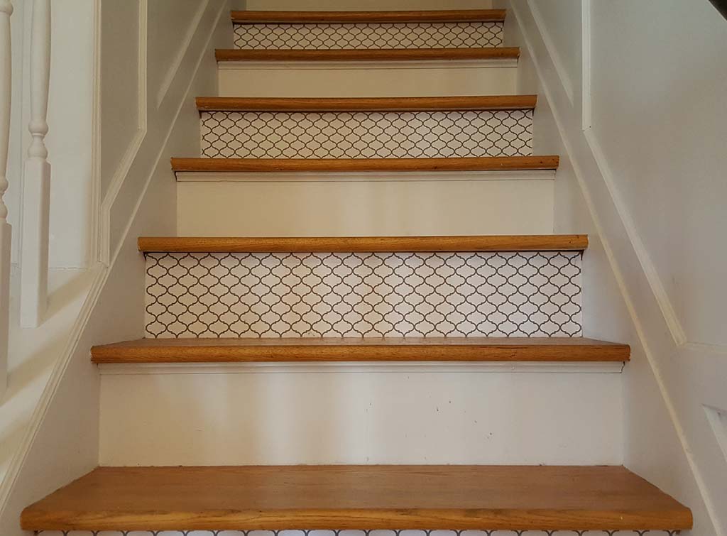 wooden stairs with patterned risers