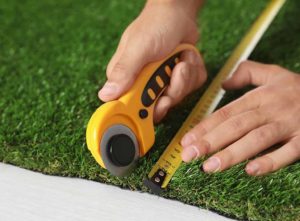 Tools for cutting artificial grass