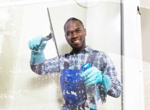 Professional window cleaner at work