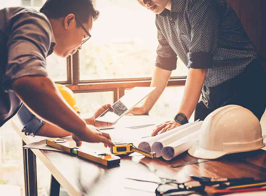Architect showing plans for Building Regulations