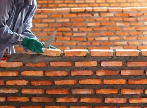 Good bricklayer laying bricks