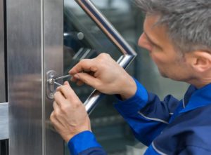 Locksmith doing carrying out lock repair