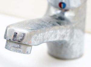 Hard water stains on a tap