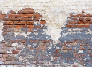 Patchy masonry paint on brick