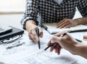 people using measured building survey plans