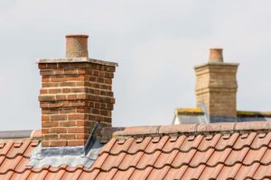red brick chimney and rooftop skyline