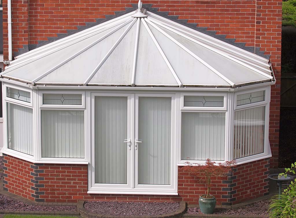 A conservatory with insulated roof panels