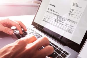 Invoice on a laptop - Making Tax Digital