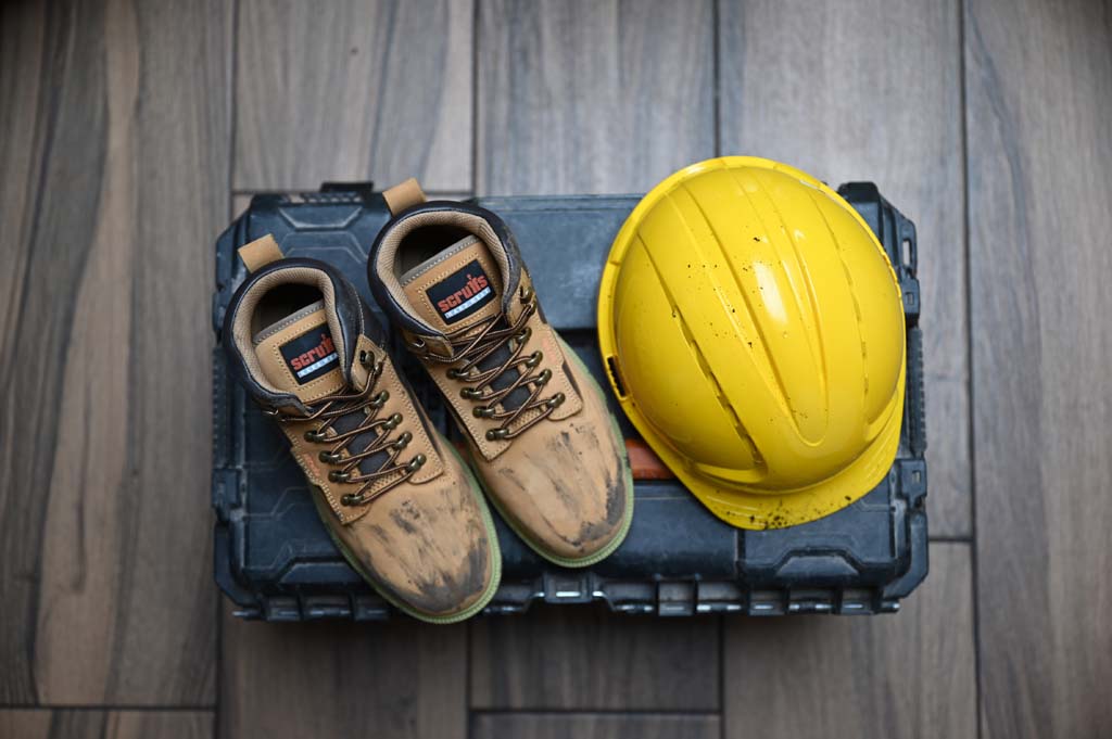 Workwear boots, helmet and toolbox