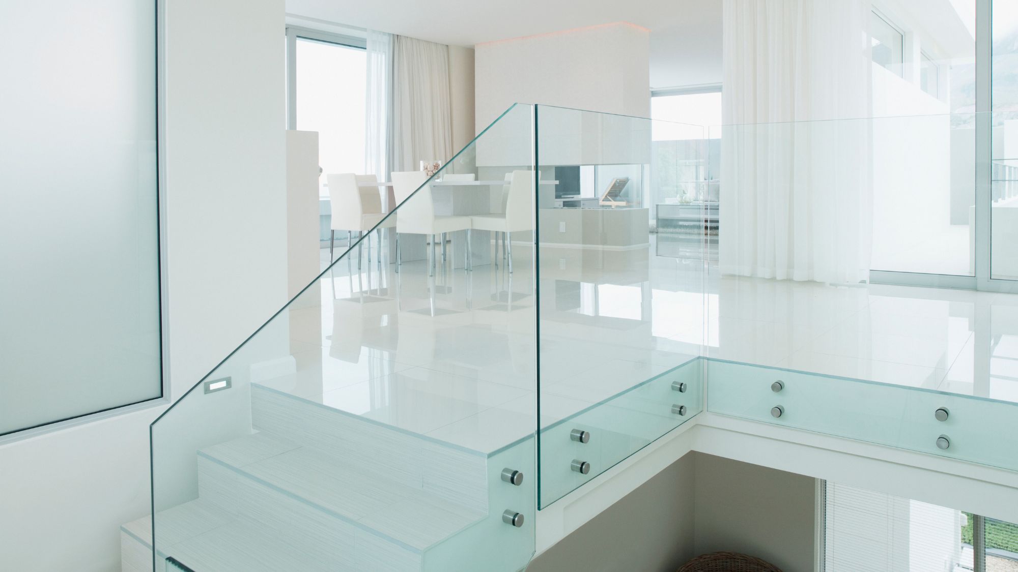 Glass stair railings in clean and minimalist home design