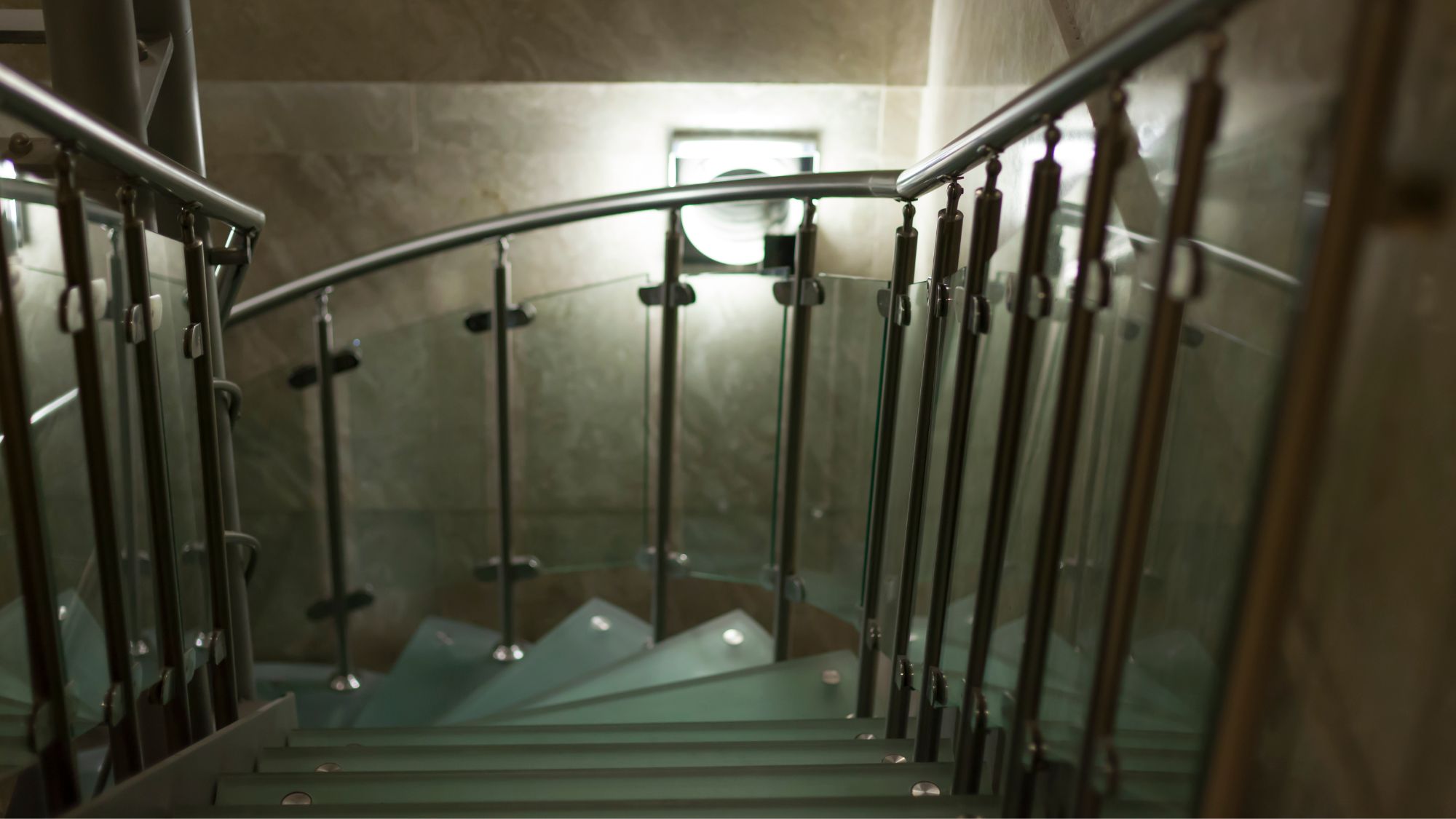 Glass banister on spiral staircase 