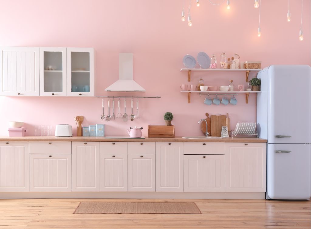 https://www.checkatrade.com/blog/wp-content/uploads/2023/09/Pastel-pink-kitchen-decor-with-fun-utensils.jpg