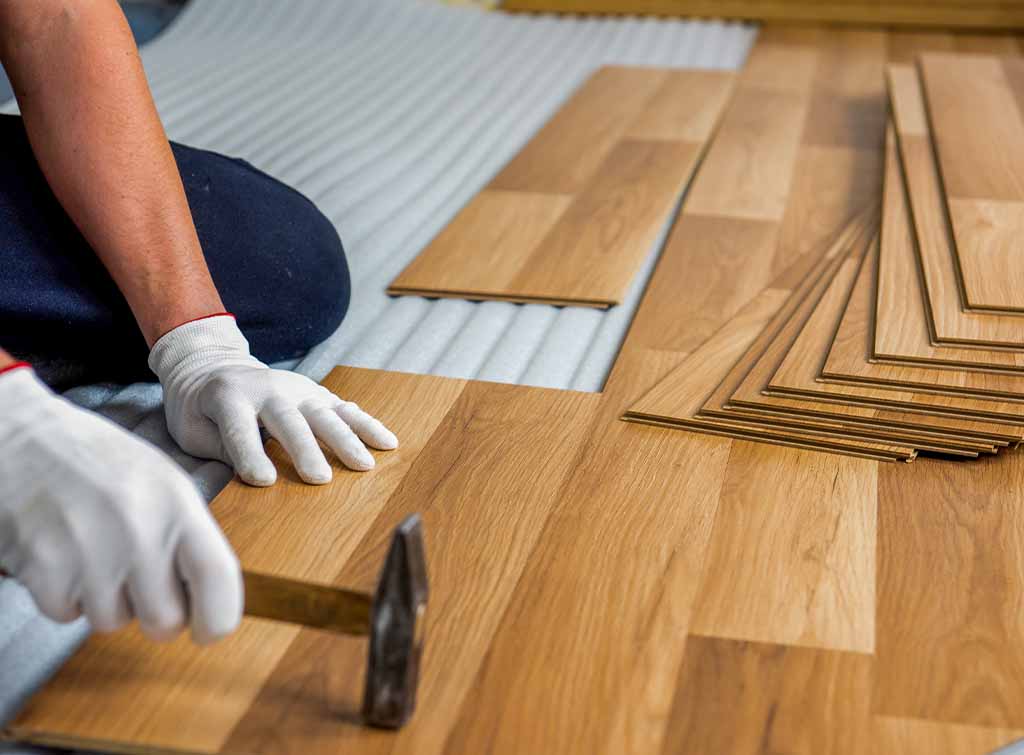 Laminate flooring being fitted by a flooring specialist