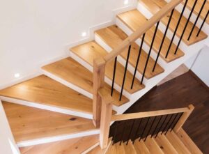 Timber staircase and iron spindles - modern stair banister ideas